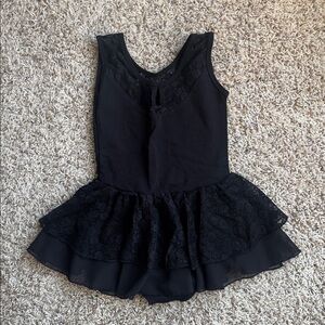 Black lace leotard with attached skirt. Super cute!